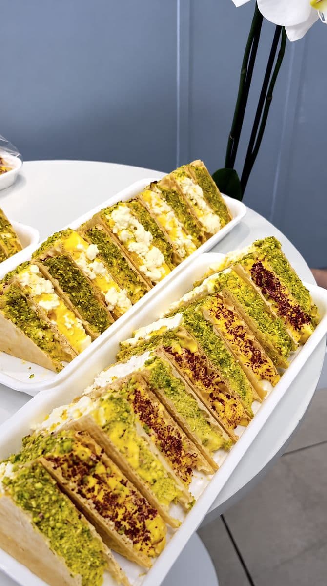 Yummy Land ice cream wafer sandwiches arranged on two white catering platters